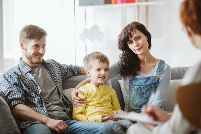Parents with Young Boy Talking to Child Therapist